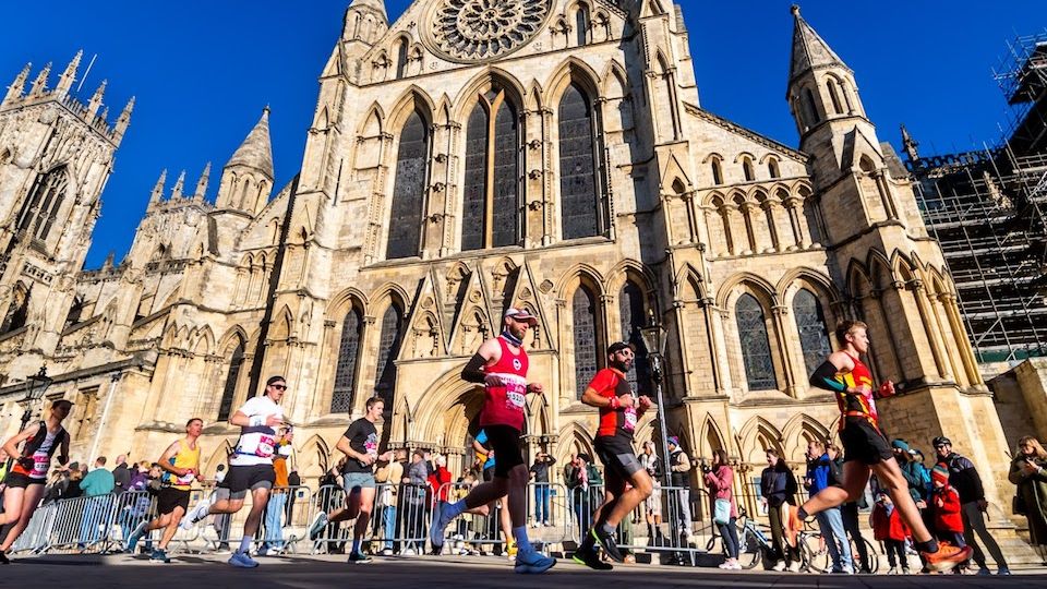 Runners passing York Minster during the Yorkshire Marathon