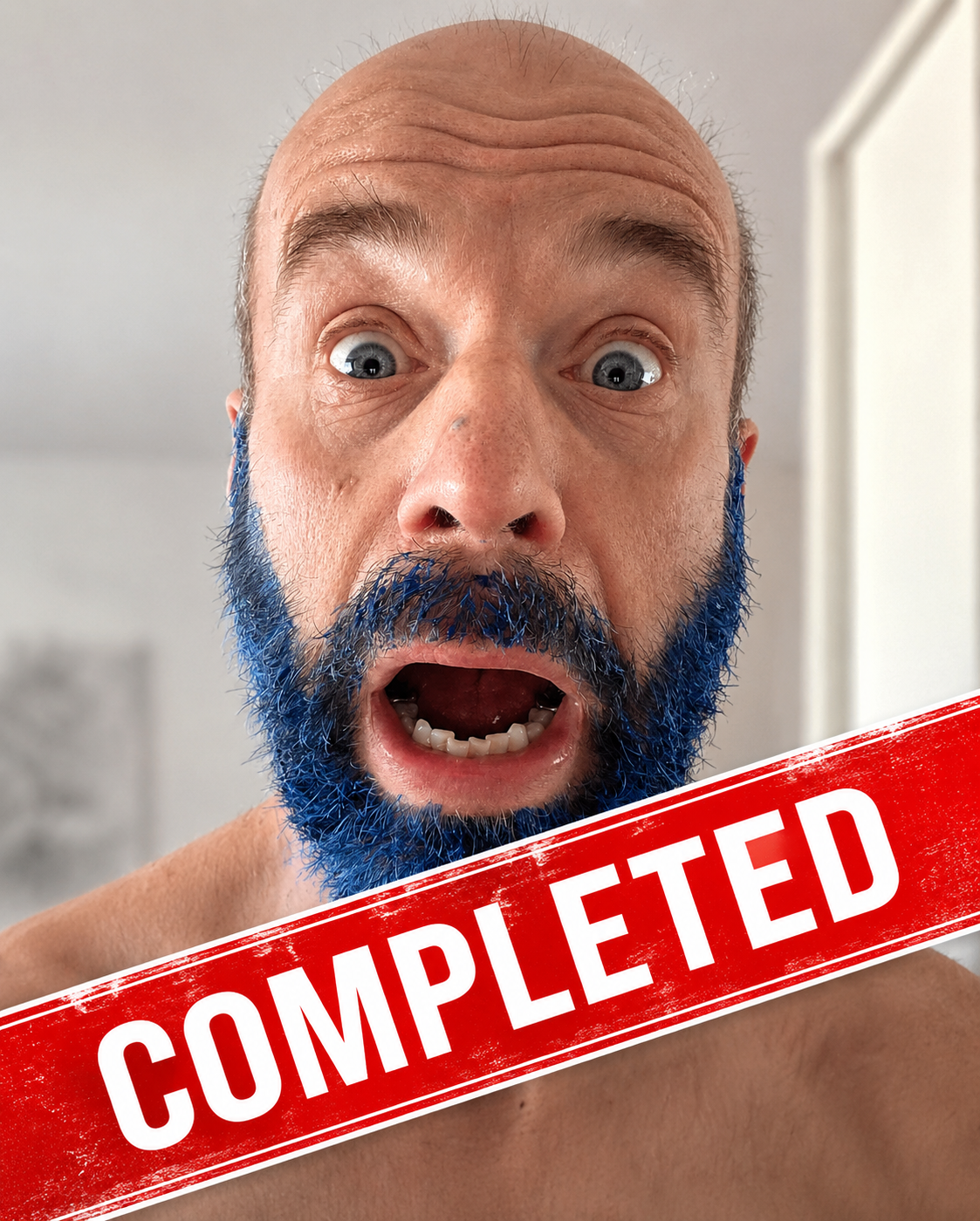 Duncan celebrating the completion of No-Shave July with his blue beard